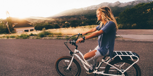 Girl Riding an Electric Bike Downhill